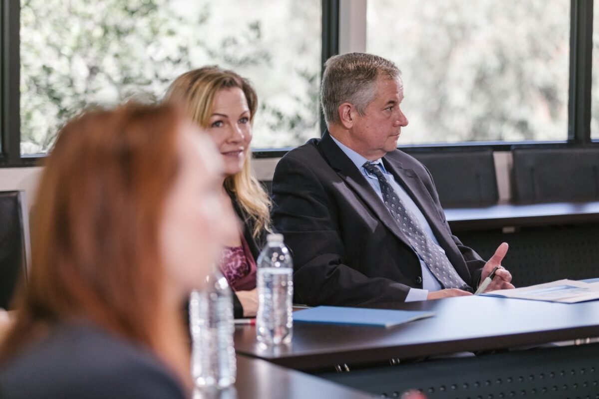 Professionals discussing documents in a business meeting