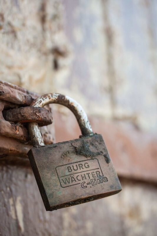 Concluding Labor Contracts with Foreigners in Vietnam — Key Notes for FDI Enterprises 3 Close-up of a rusty padlock on an old wooden door