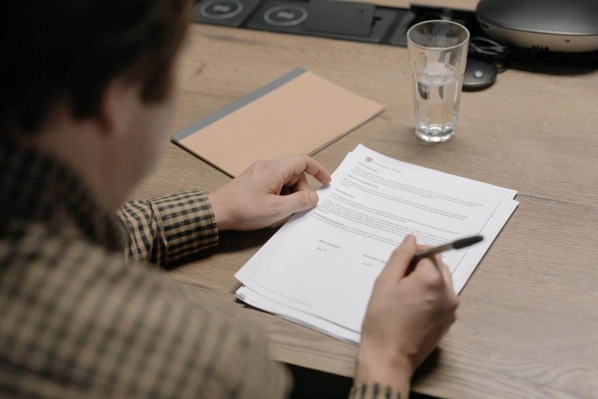 Businessperson reviewing a contract at a desk