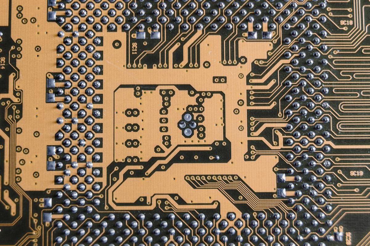 Close-up of an electronic circuit board with intricate metallic traces