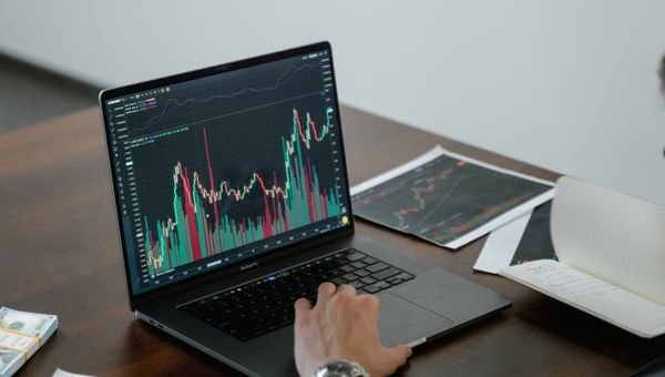 Performance chart on a laptop screen (illustrative)