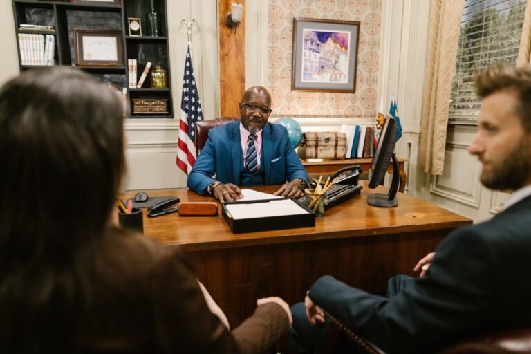A group of people having a meeting inside the office