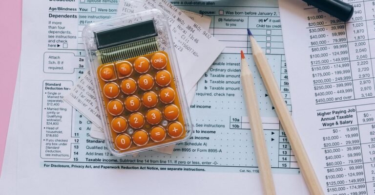 Calculator and tax documents (illustrative)