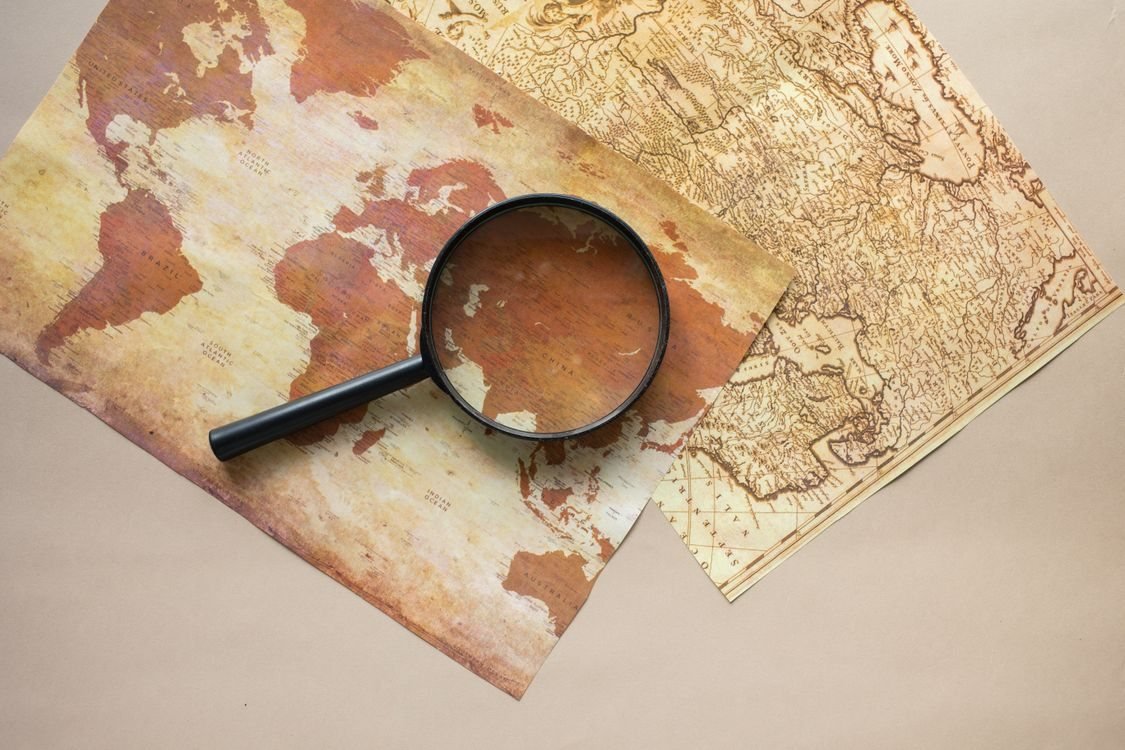 Magnifying glass over planning maps