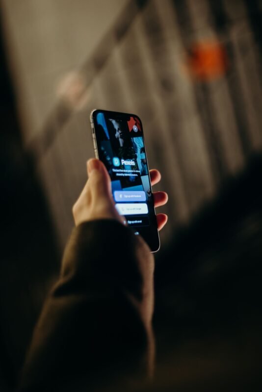 User reading product reviews on a smartphone (illustrative)