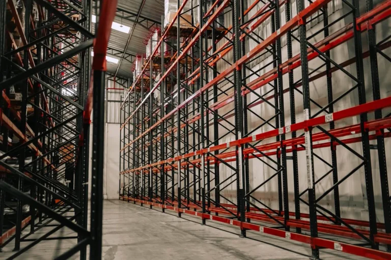 Empty warehouse interior with metal racks