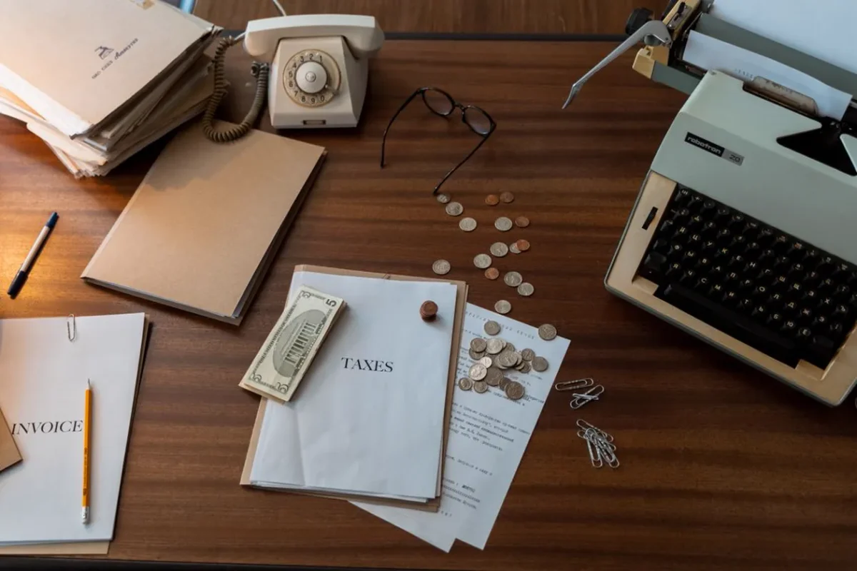 Workspace with documents on a wooden table