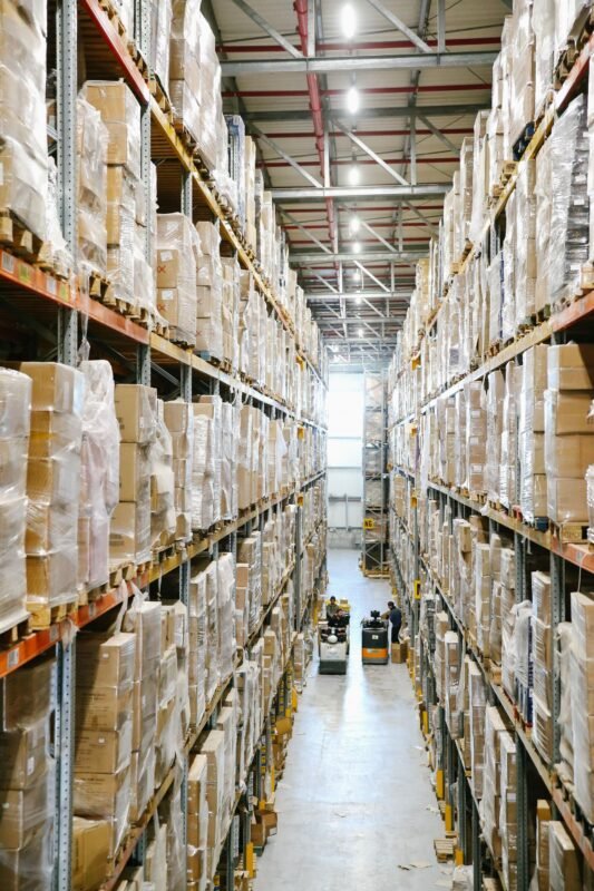 Authorizing a logistics forwarder for customs declaration — warehouse aisle with storage racks