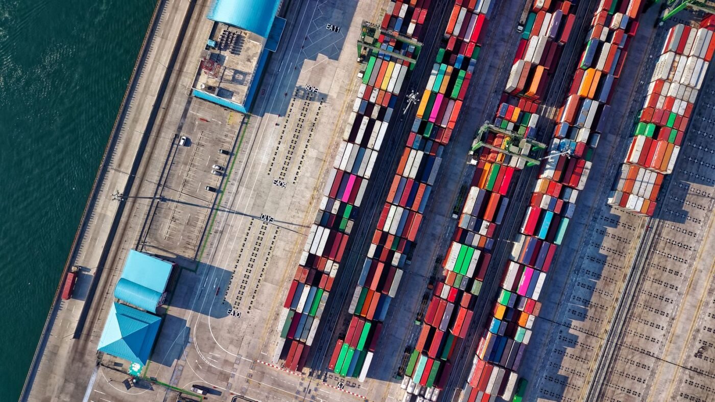 Aerial view of a container port with stacked cargo containers — appealing post-clearance audit findings