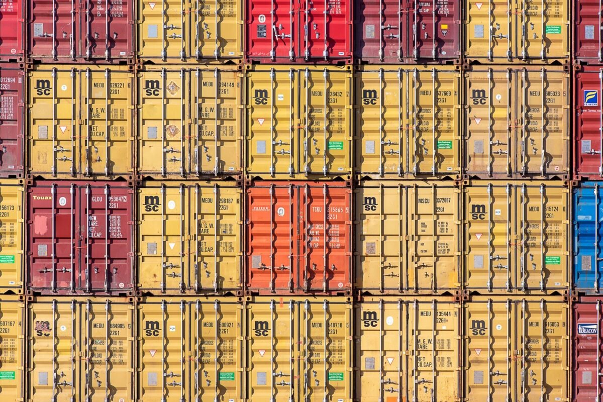 Fines for misdeclaration causing import tax shortfalls 1 Close-up of container doors with shipping labels — fines for misdeclaration causing import tax shortfalls