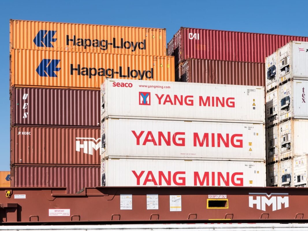 Stacked shipping containers at a depot — violations of bonded warehouse regulations