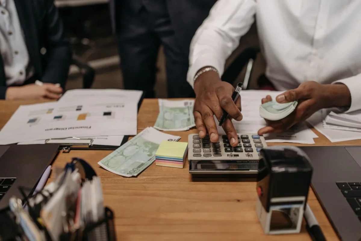 Foreign-invested accounting firms in Vietnam — accountant calculating finances with a calculator and documents