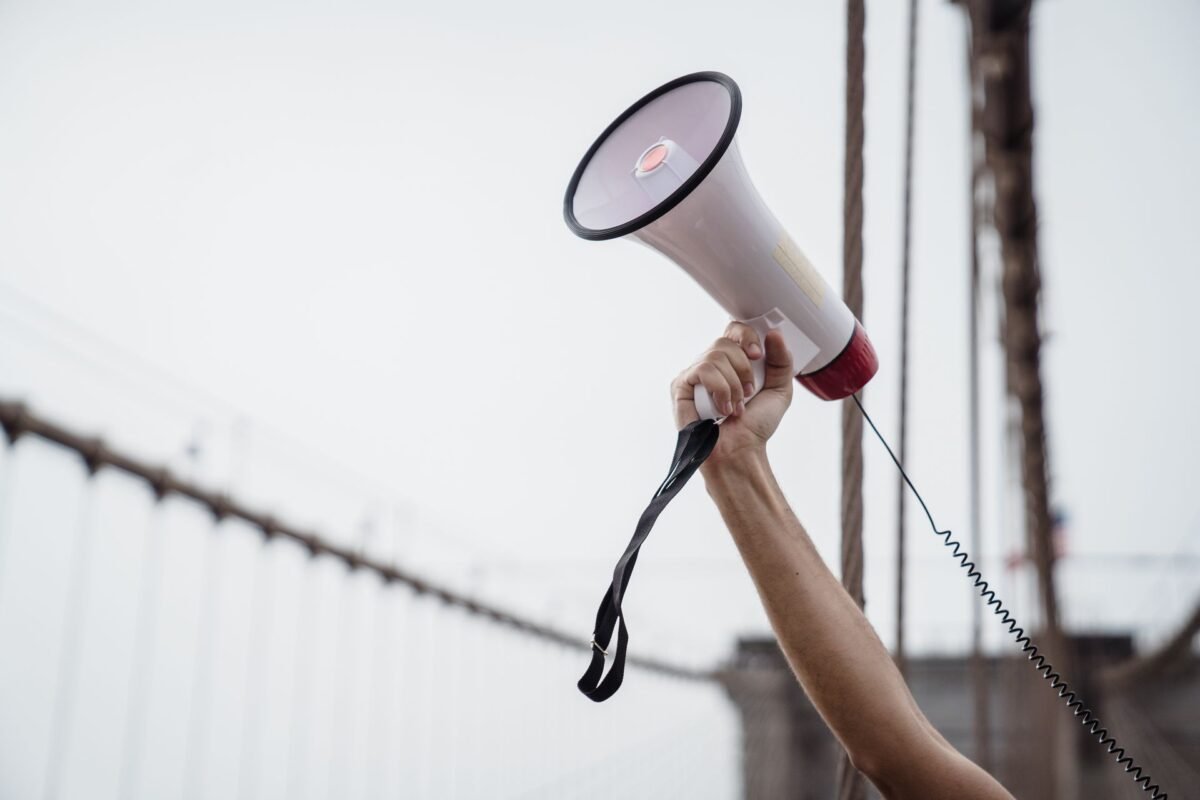 FCT on Google & Facebook Ad Spend in Vietnam: Withholding Rules Explained 1 Hand holding a megaphone — illustrating online advertising activity, no face visible