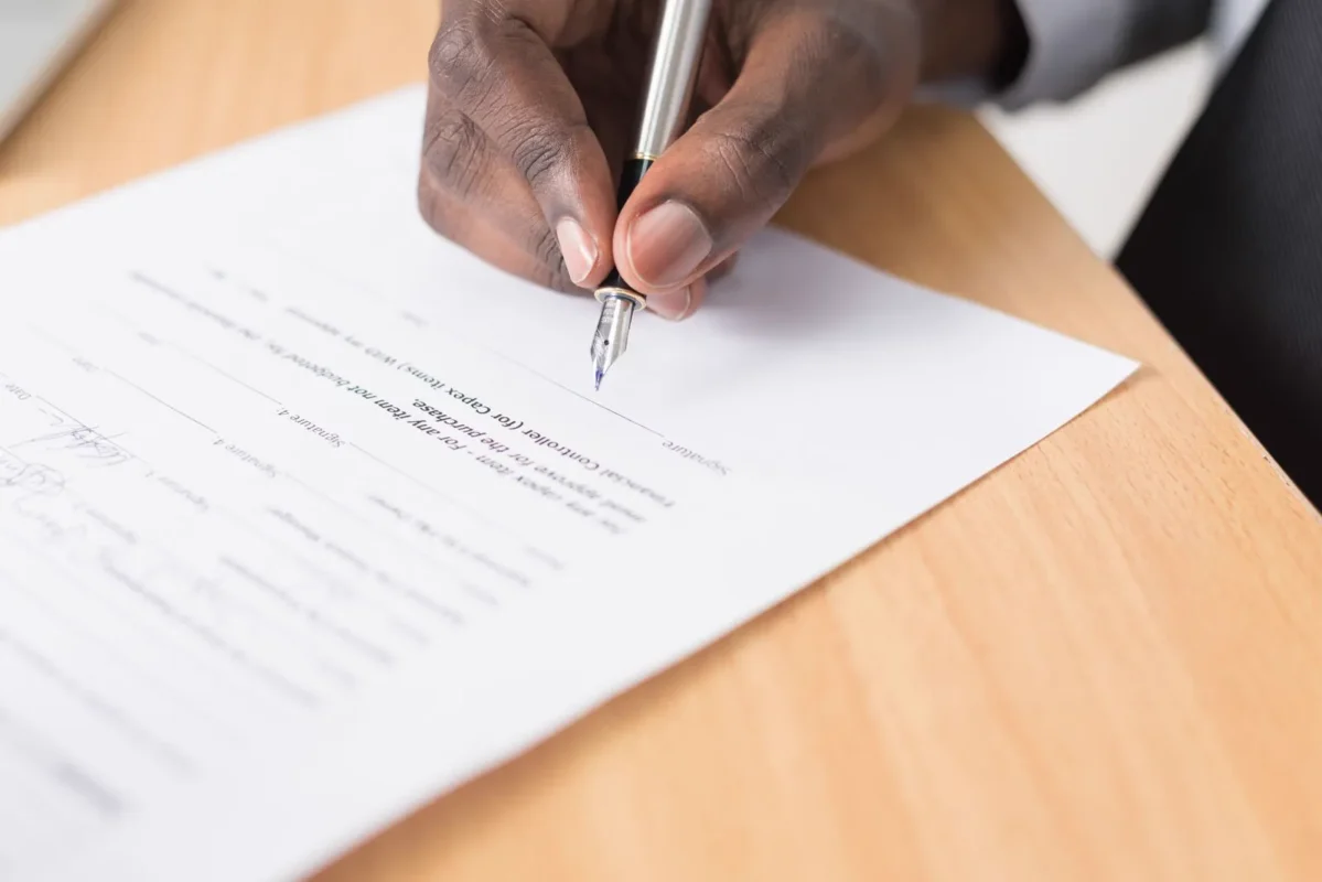 Fountain pen signing documents — illustrating post-M&A legal representative change