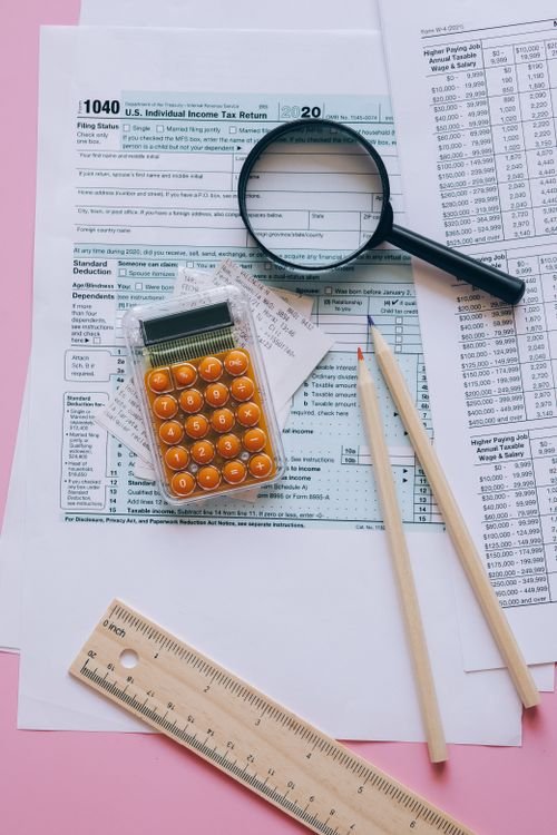 Calculator and tax forms — illustration for the article on tax code registration fees for foreigners