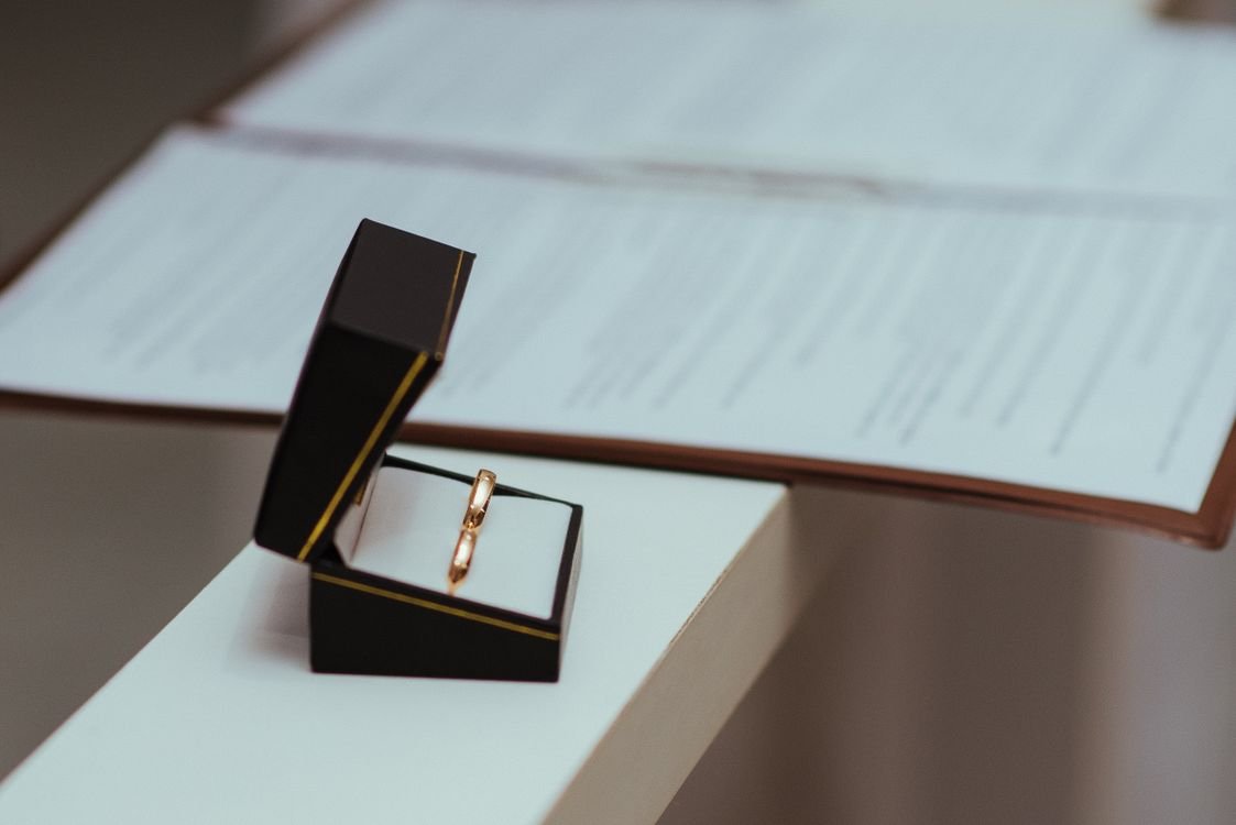 Wedding rings on a marriage certificate — illustration for the article on foreign-element marriage registration