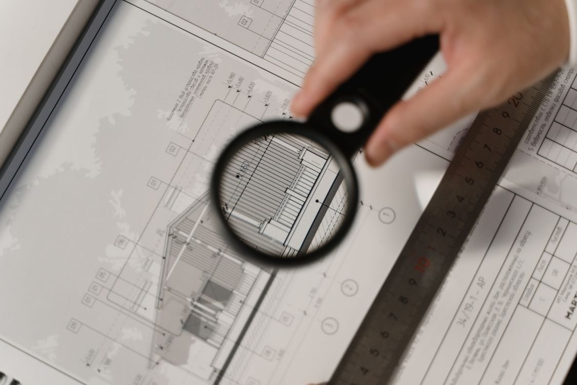 Property valuation with magnifier and blueprints — asset valuation costs in FDI project transfers