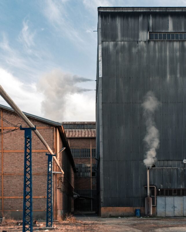 FDI Project Relocation out of an Industrial Zone: IRC Amendment and Incentive Treatment 1 Industrial warehouse exterior — illustration for the article on FDI project relocation out of an industrial zone and IRC amendment