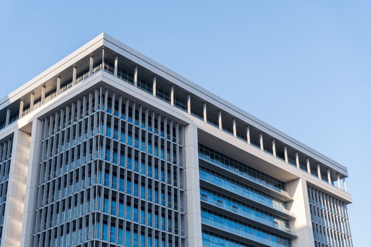 Modern glass building in a technology park — illustration for the article on investing in hi-tech parks and innovation centers