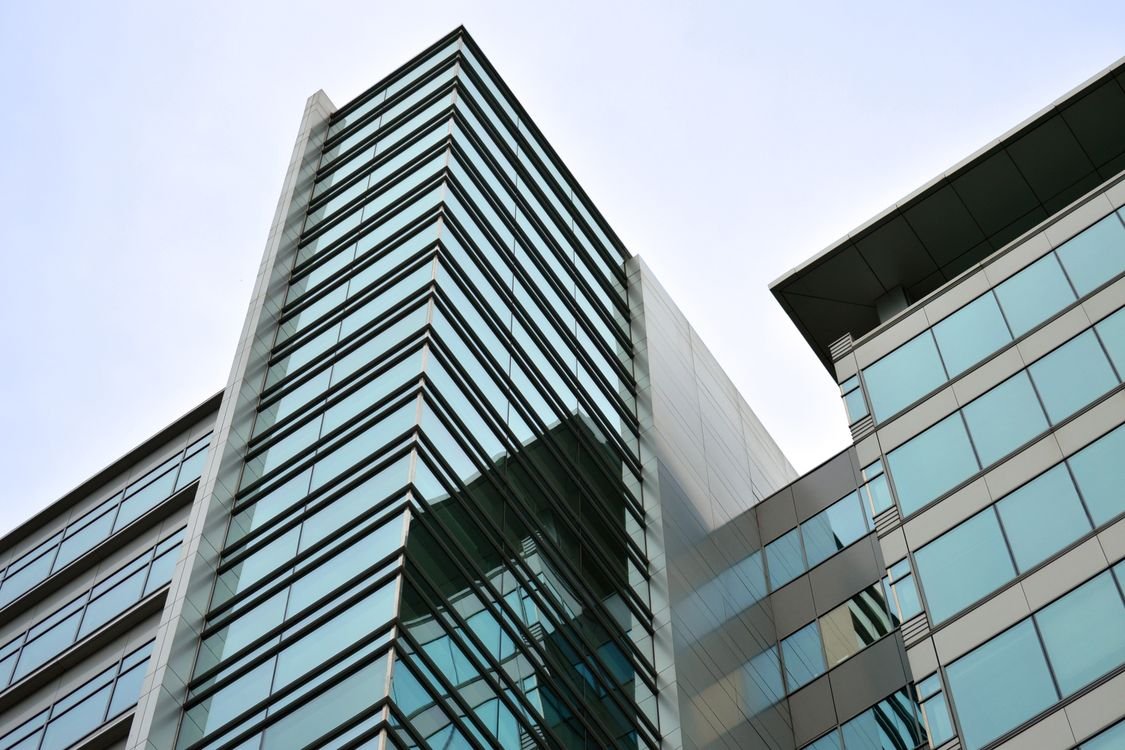 Vietnam doubles merger filing thresholds from 1 July 2026: what dealmakers must re-check 1 Modern glass office tower — merger filing thresholds 2026