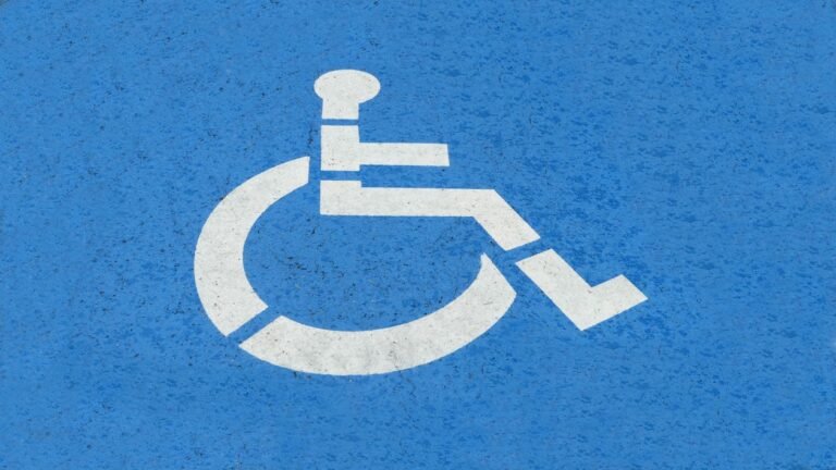 Wheelchair accessibility symbol — employing disabled workers