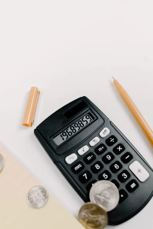 Calculator and financial documents — debt recovery illustration