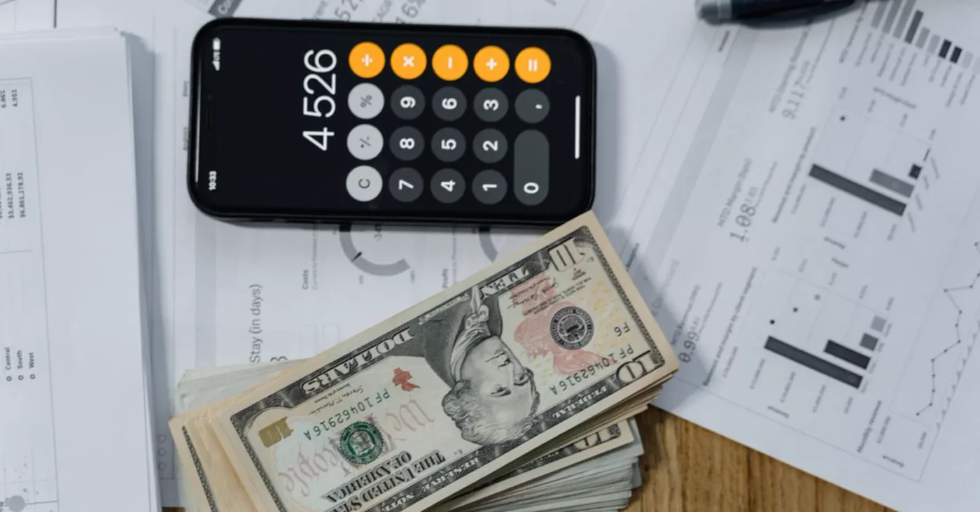 Cash, calculator and financial documents — charter capital and capital contribution: Vietnam vs China compared