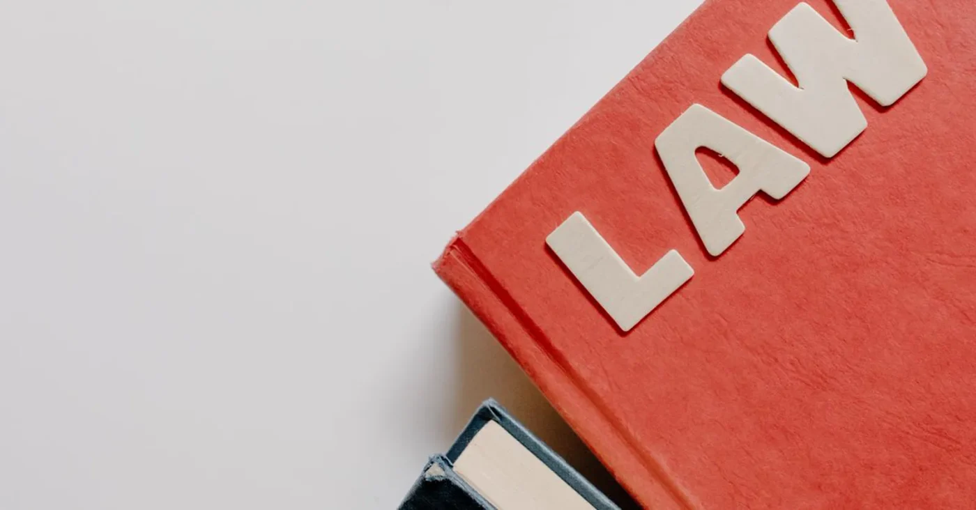 Red book with the word LAW — capital contribution disputes among shareholders and members: litigation and mediation