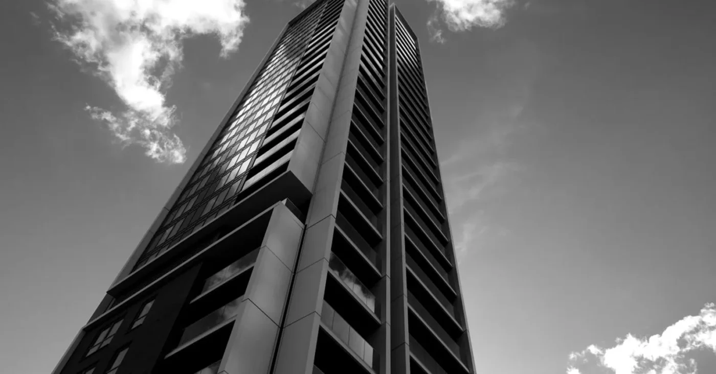 Grayscale skyscraper from below — management liability of Vietnamese enterprises in disputes
