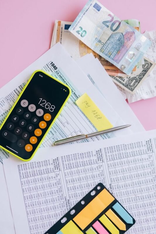 Calculator and real estate documents — property valuation
