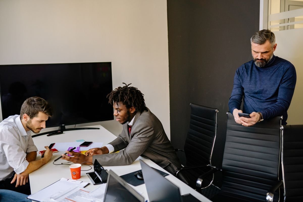 Colleagues discussing work at the office