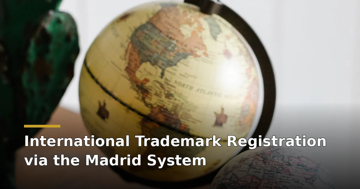 Two vintage globes on a wooden desk — international trademark registration via Madrid