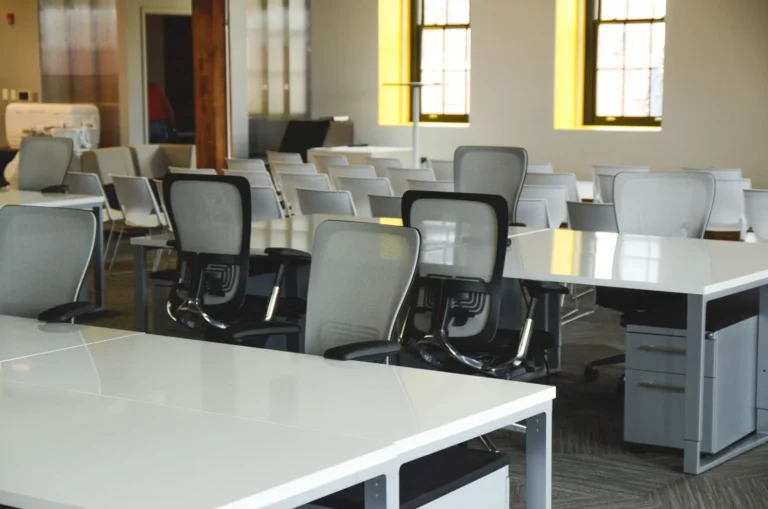 Empty modern office with desks and chairs — illustration for an article comparing Vietnamese and Chinese labor law
