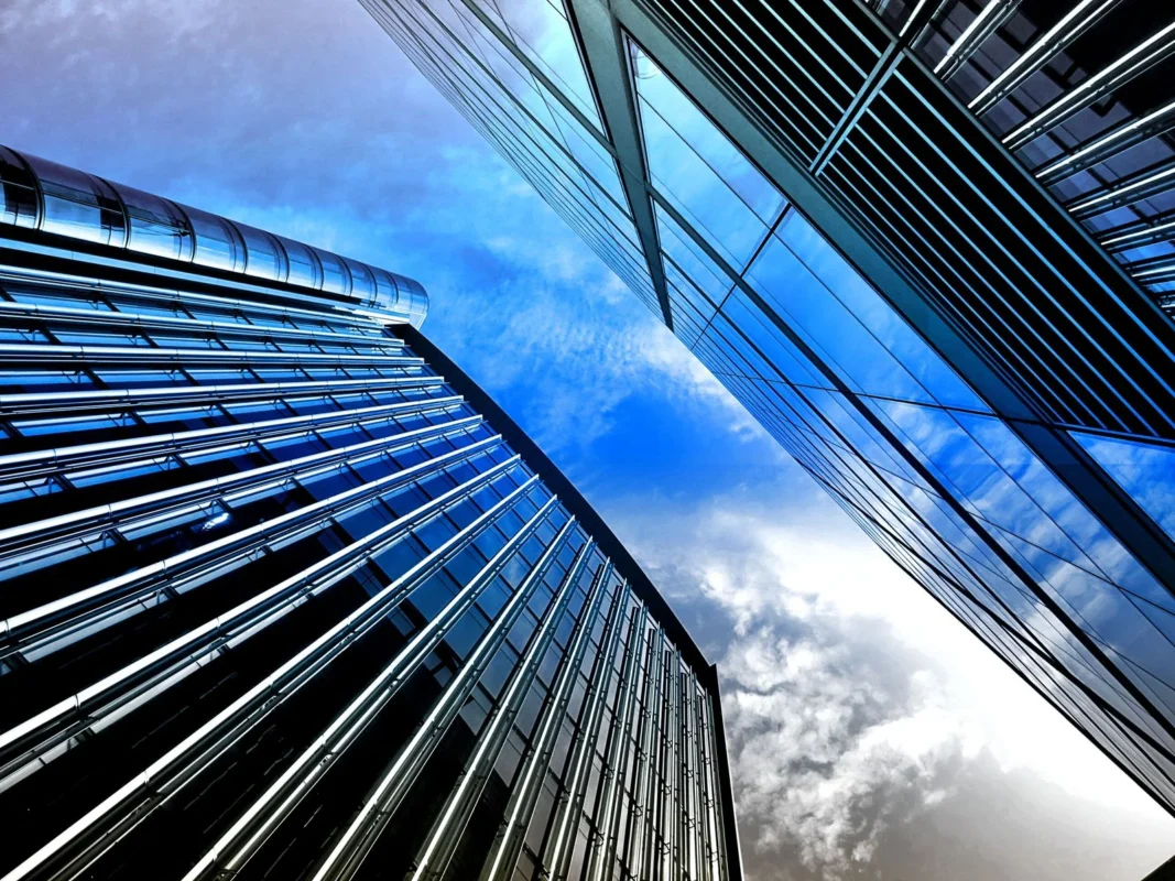 Low-angle view of modern skyscrapers — illustration for an article comparing Vietnam's Investment Law 2025 and China's Foreign Investment Law