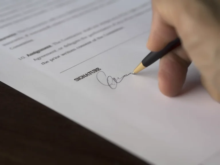 Signing a document — illustrating a labor contract termination decision