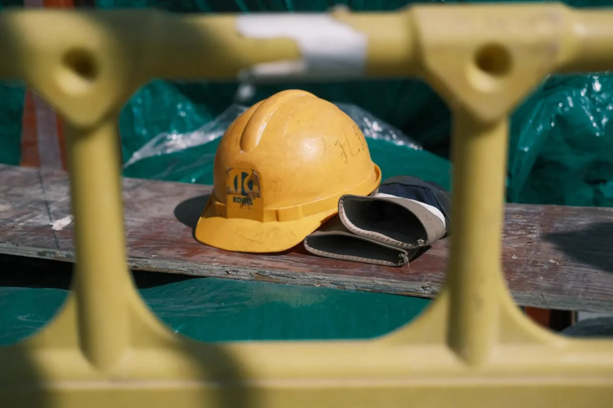 Yellow safety helmet on a construction site; no people