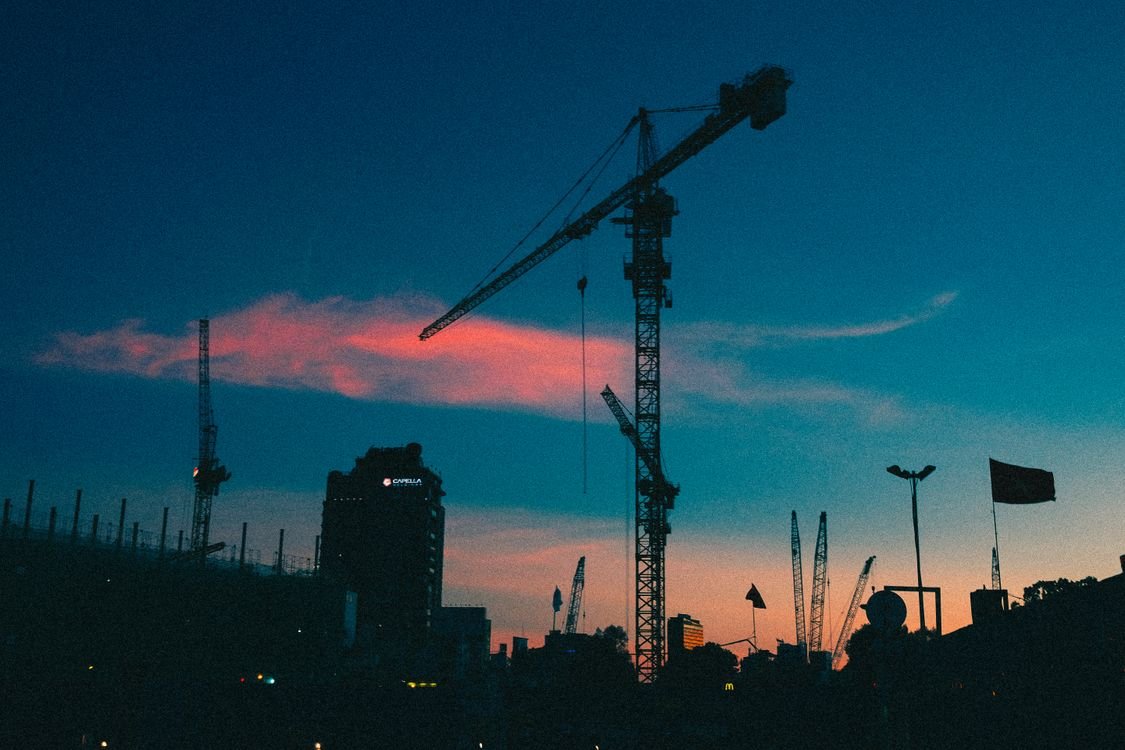 Construction crane silhouette at dusk