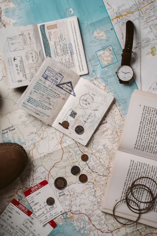 Passports with visa stamps on a travel map