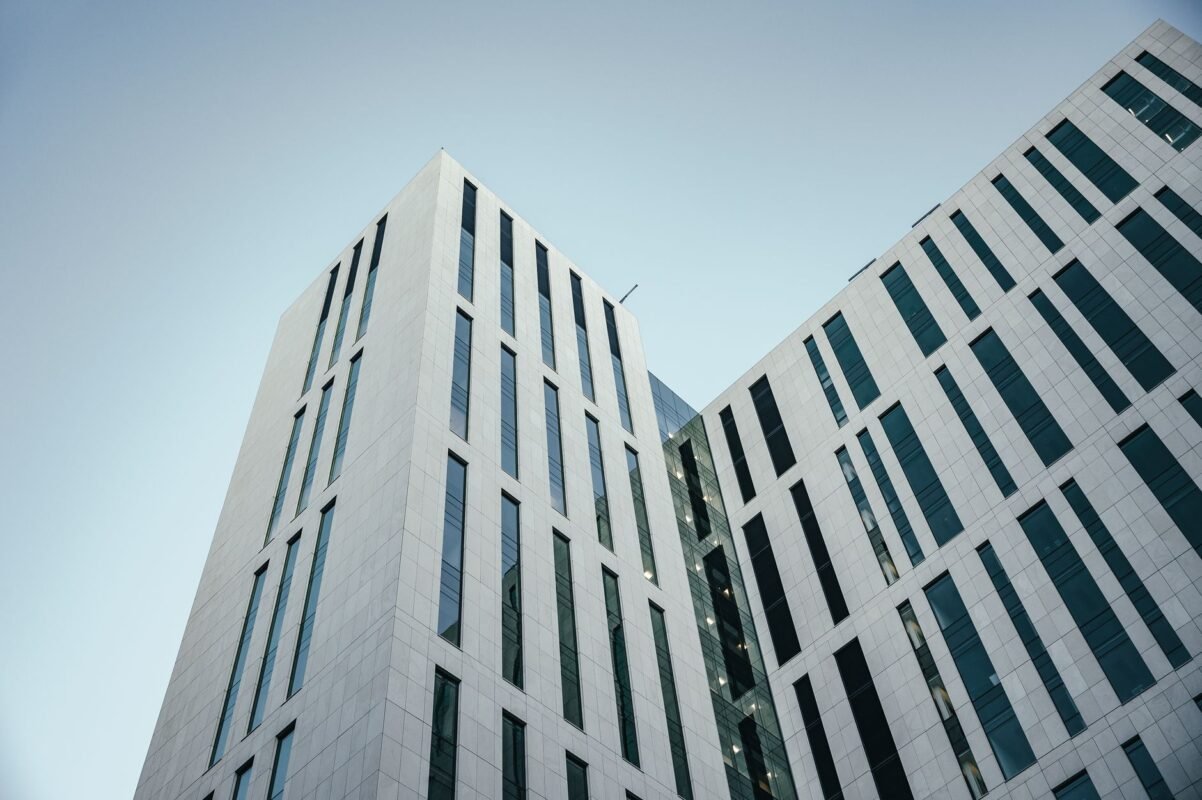 Can a company commit money laundering in Vietnam? 1 Modern white office building viewed from below — illustrating corporate criminal liability for money laundering