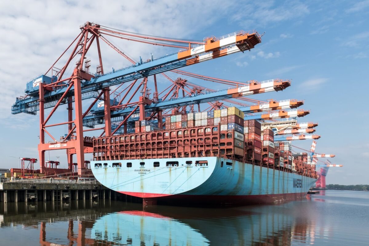 Commercial invoice, sale contract and calculator on a customs accounting desk