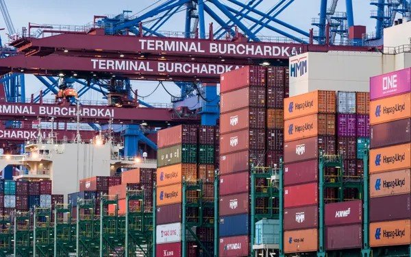 Container terminal with stacked cargo containers — illustrating goods subject to export duty in Vietnam