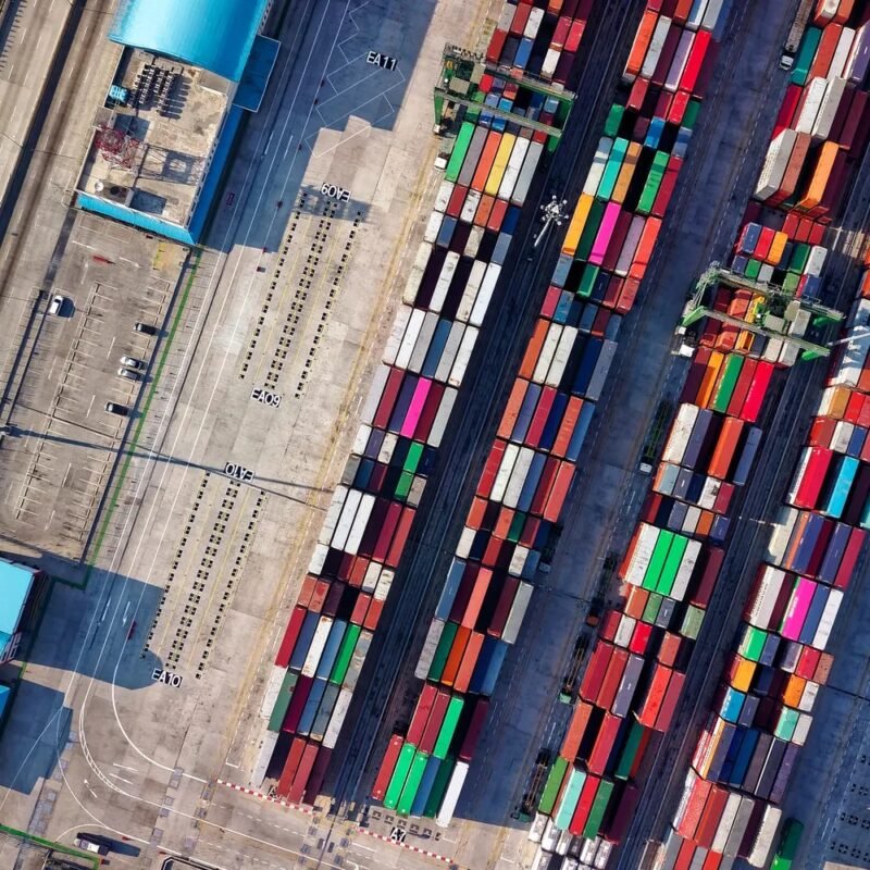 Cases of non-collection of import tax: distinguishing from exemption and refund 1 Aerial view of a container yard — illustrating cases of import duty non-collection for businesses