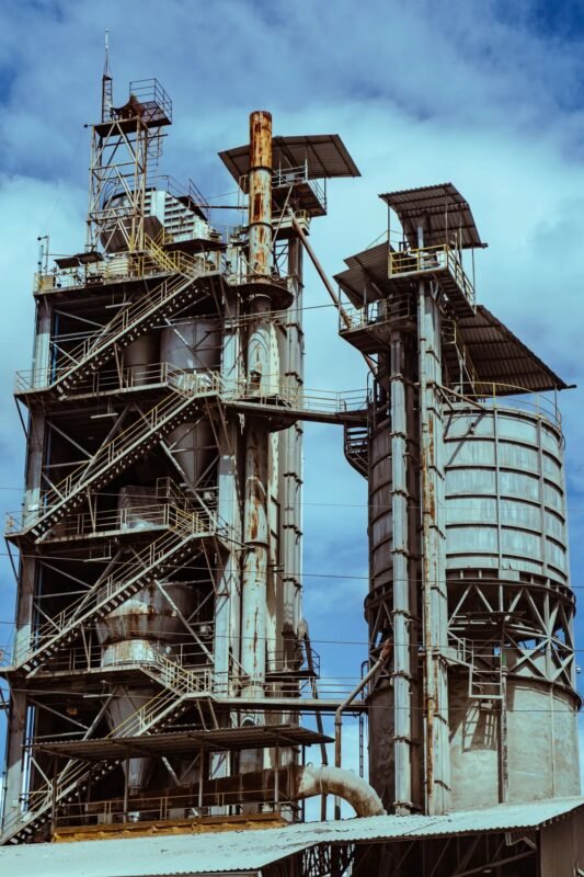 Industrial plant towers — illustrating FDI project transfer and retention of import-export tax incentives