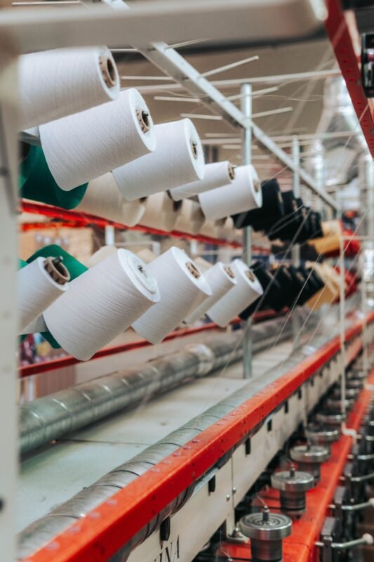 Textile thread spools on a production machine