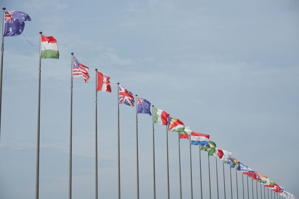 Row of national flags on flagpoles