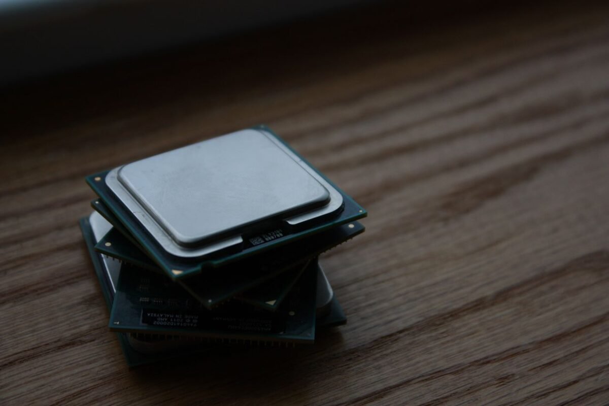Close-up of stacked computer processors — illustrating technology transfer from a Chinese parent company, no people