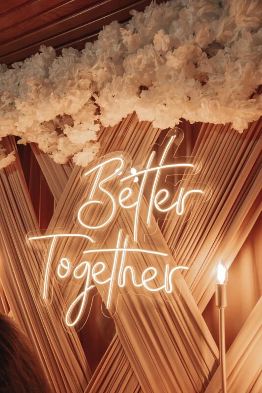 Marriage Between Chinese and Vietnamese Citizens: Registration Procedure 1 Illuminated Better Together wedding sign with floral decor — illustrating marriage registration for couples, no people