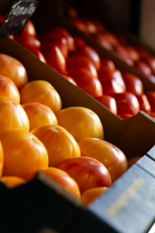 Fresh tomatoes displayed at a market stall