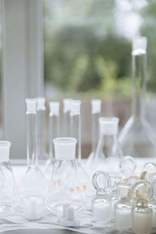 Laboratory glassware and pills — illustration for an article on pharmaceutical patents