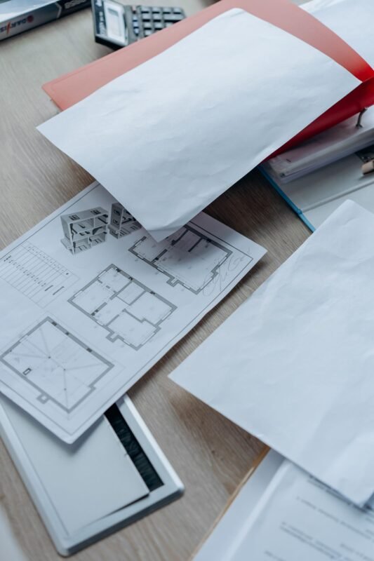 Office desk and contract documents — illustration for an article on employee-created inventions